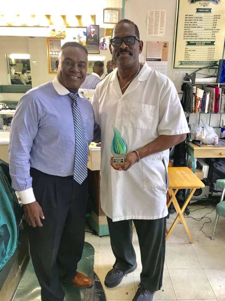 City Market Barber Shop's Richard Bowden Accepting the Downtown Business Alliance Legacy Award | Raleigh NC (pic: Facebook)